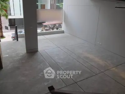 Spacious modern interior with large windows and minimalist design