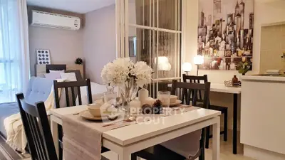 Chic modern studio apartment with stylish dining area and cozy bedroom.