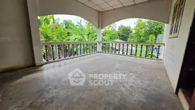 Spacious balcony with lush green views, perfect for relaxation and outdoor enjoyment.