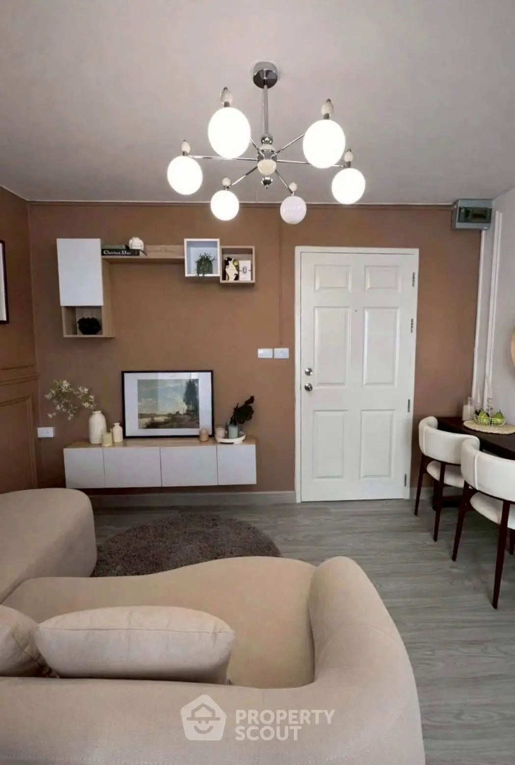 Stylish living room with modern decor and elegant lighting, perfect for cozy gatherings.