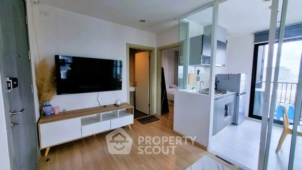Modern apartment interior with open kitchen and balcony view