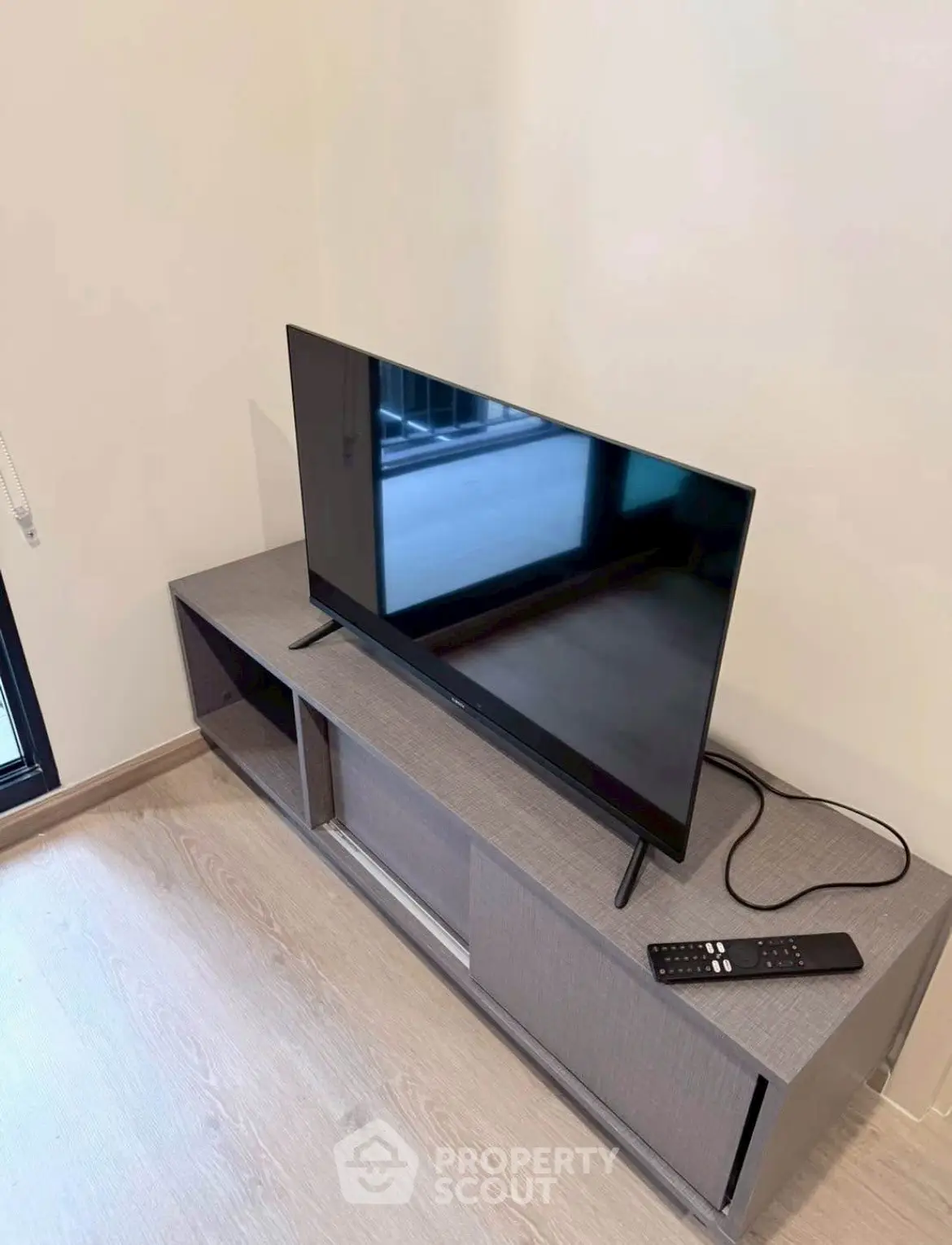 Modern living room with sleek TV setup on stylish console