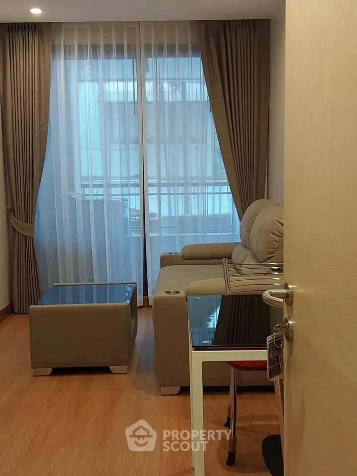 Cozy living room with modern furniture and large window for natural light