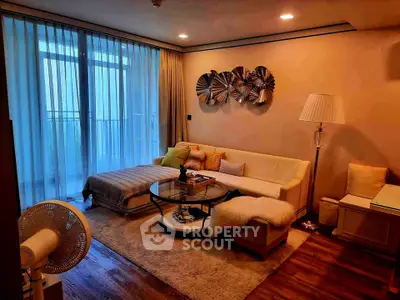 Elegant living room with modern decor and large windows