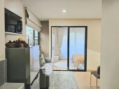 Modern apartment interior with cozy living room and bedroom view