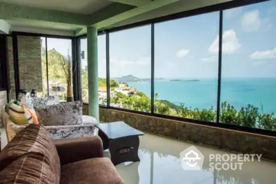 Stunning living room with panoramic ocean view and modern decor