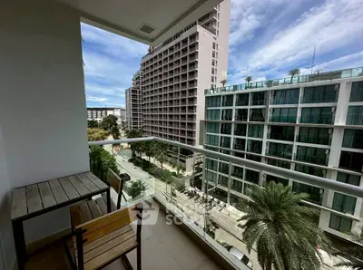 Modern balcony with city view in high-rise apartment building.