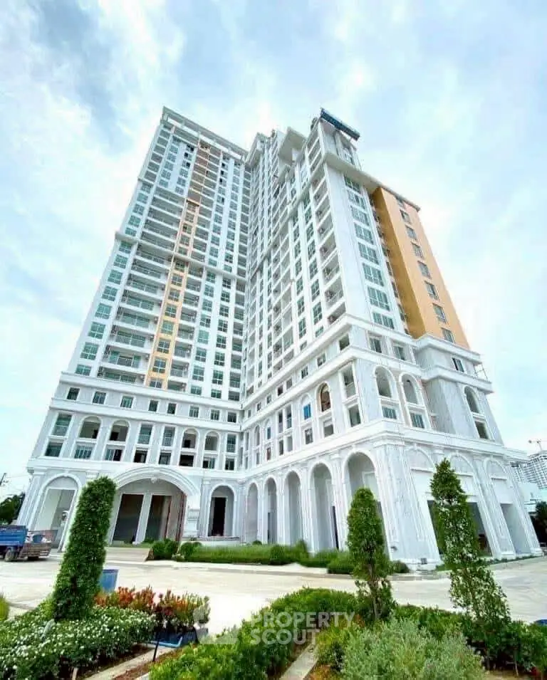 Stunning high-rise building with elegant architecture and lush landscaping.