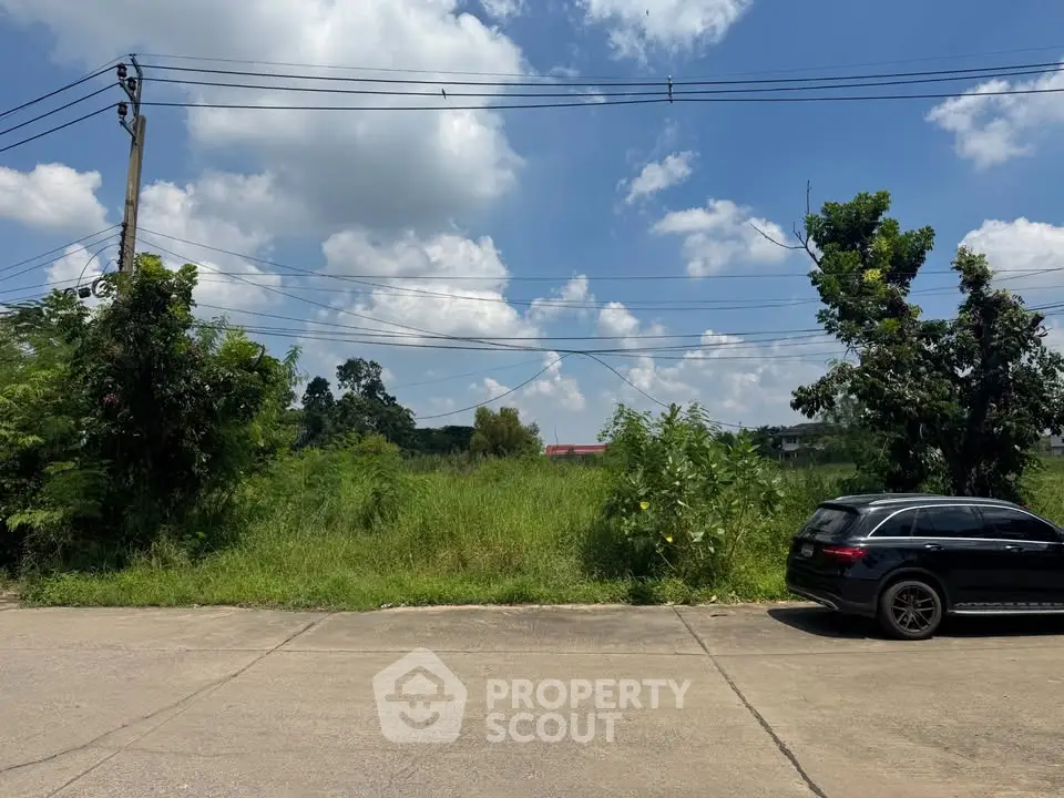 Vacant land with potential for development under a clear blue sky.