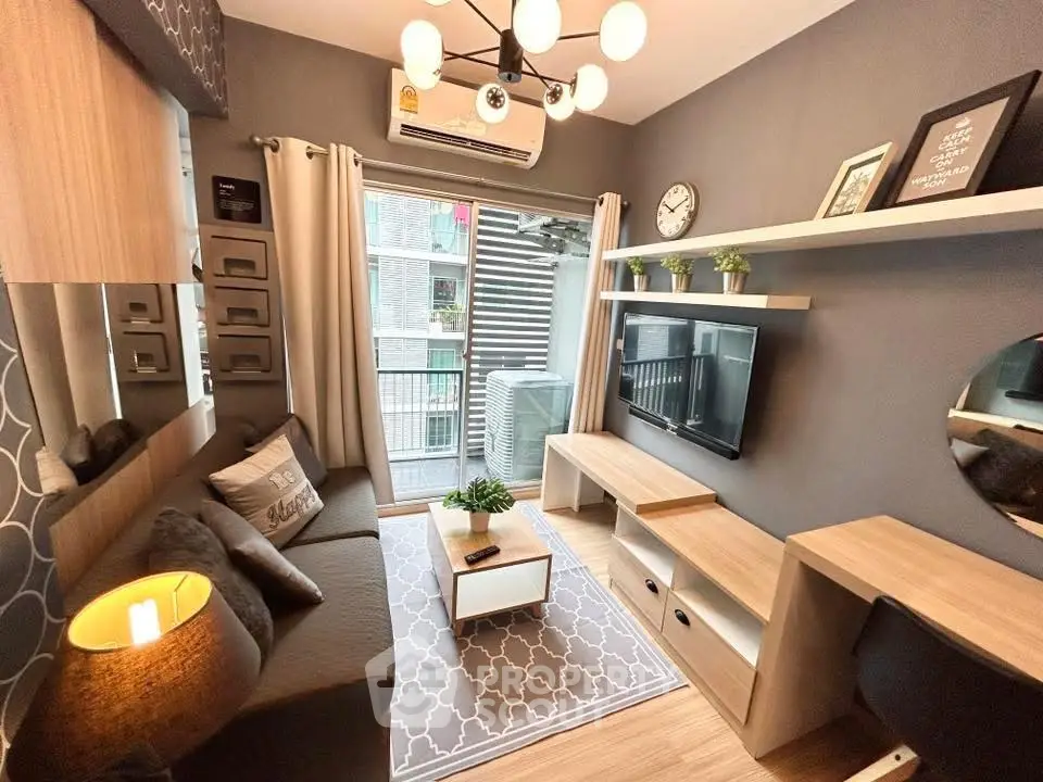 Modern living room with stylish decor and balcony view, featuring a cozy sofa and wall-mounted TV.