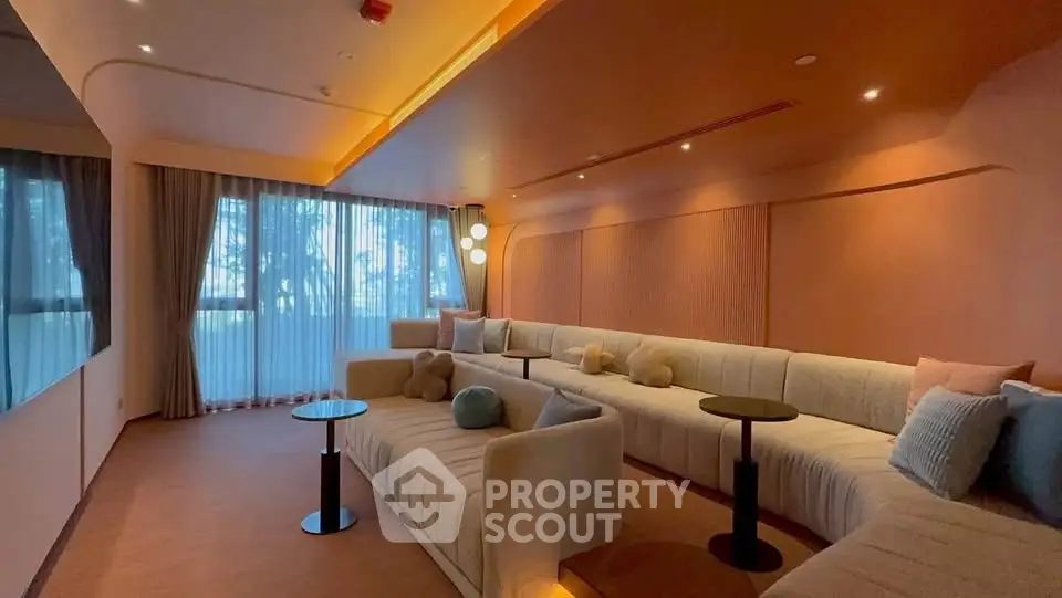 Luxurious modern living room with elegant lighting and plush seating, perfect for relaxation and entertainment.