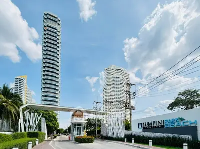 Luxurious beachfront condominium with modern architecture and lush surroundings at Lumpini Park Beach.