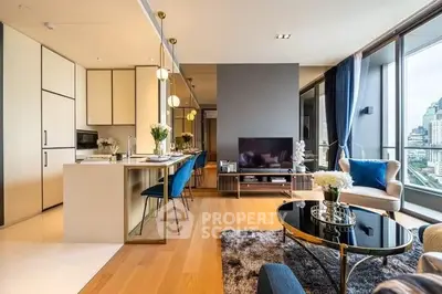 Luxurious modern living room with city view, elegant decor, and open kitchen layout.