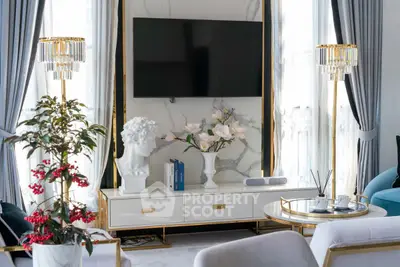 Luxurious living room with elegant decor and modern TV setup