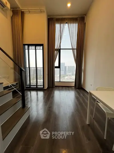 Modern high-rise apartment with floor-to-ceiling windows and city view, featuring sleek wooden flooring.