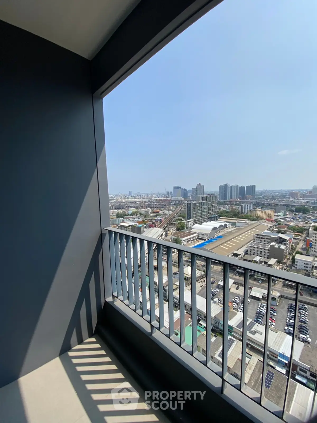 Stunning city view from a high-rise balcony, perfect for urban living enthusiasts.