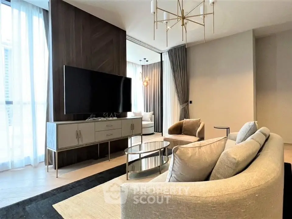 Luxurious modern living room with elegant decor and large TV