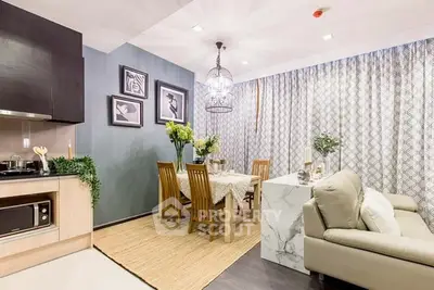 Stylish open-plan living and dining area with modern decor and elegant furnishings.