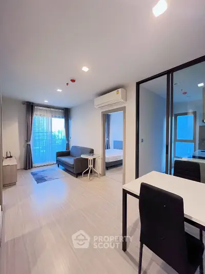 Modern living room with sleek design and natural light in urban apartment