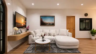 Elegant living room with modern decor, cozy sectional sofa, and stylish wall art, perfect for relaxation and entertainment.