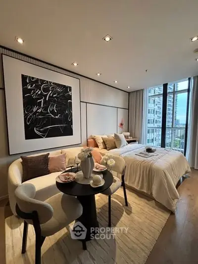 Stylish modern bedroom with cozy seating area and large window view