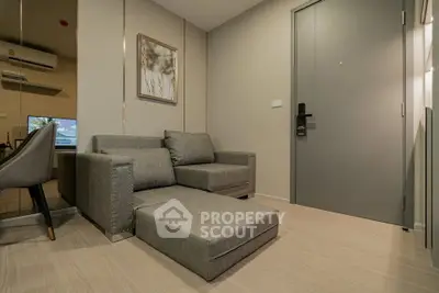 Modern living room with sleek gray sofa and stylish decor