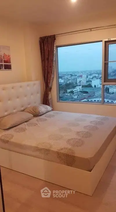 Cozy bedroom with city view and elegant decor in modern apartment