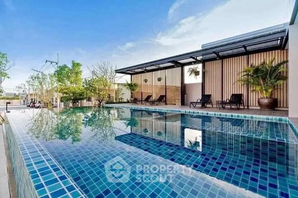 Luxurious rooftop pool with modern design and relaxing lounge area.