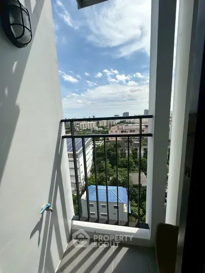 Charming balcony with stunning city view and clear blue sky