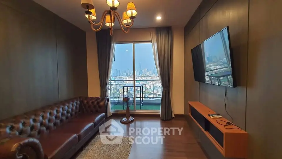 Luxurious living room with city view, elegant leather sofa, and wall-mounted TV in modern apartment.