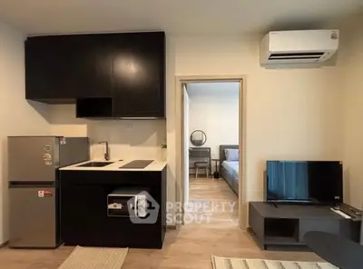 Modern apartment interior with sleek kitchen and cozy living area