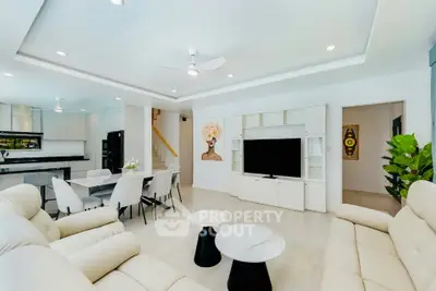 Spacious modern living room with elegant decor and open layout, perfect for entertaining.