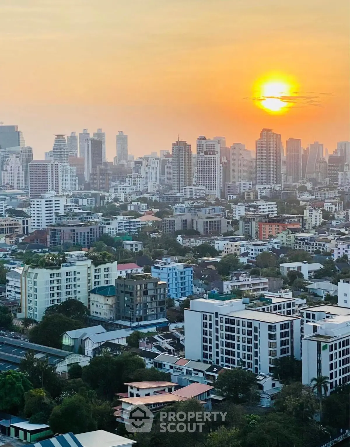 Stunning city skyline view at sunset with high-rise buildings and vibrant urban landscape.