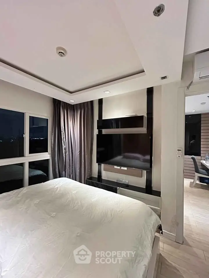Luxurious bedroom with modern decor and large window view