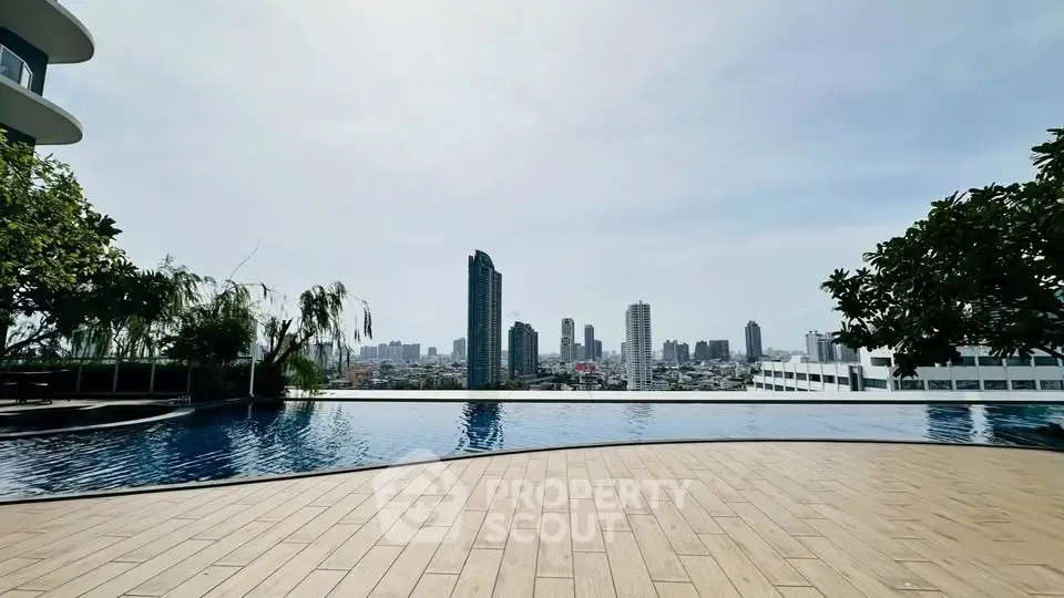 Stunning rooftop pool with panoramic city skyline views, perfect for luxury urban living.