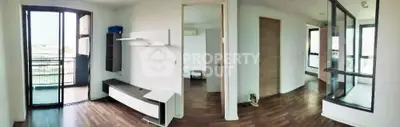 Spacious modern apartment interior with wooden flooring and large windows