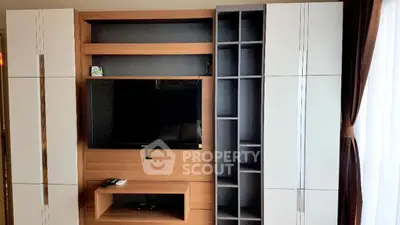 Modern living room with sleek TV unit and ample storage space