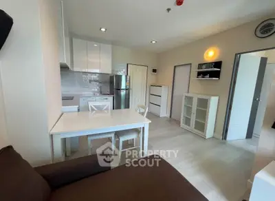Modern open-plan living room with kitchen in a cozy apartment