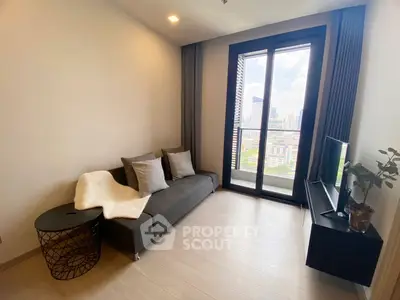Modern living room with city view, featuring sleek furniture and large windows.