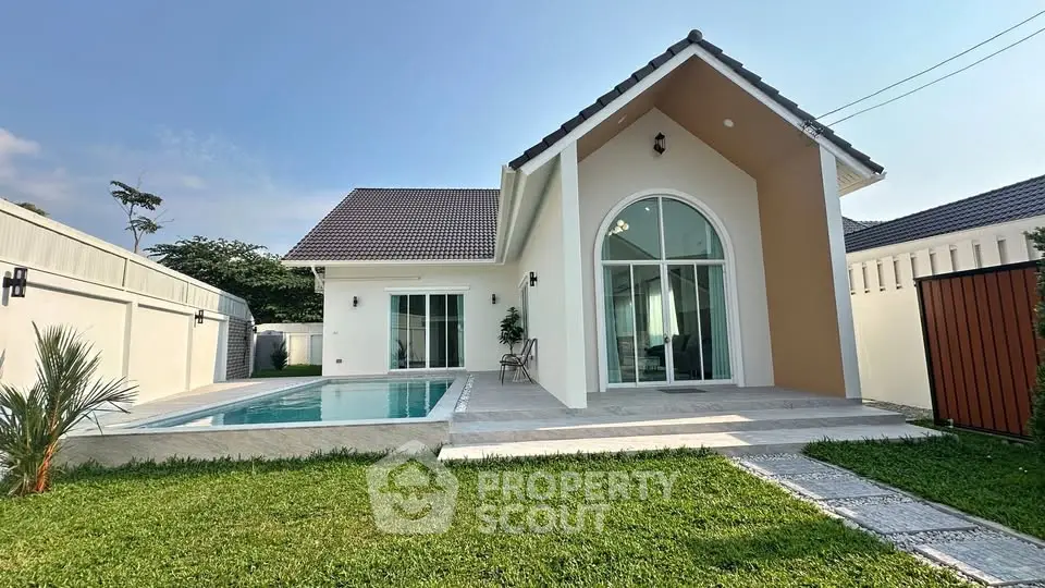 Charming modern villa with pool and lush garden, perfect for luxury living.