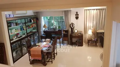 Charming living room with elegant decor and large windows for natural light.