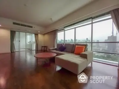 Spacious living room with panoramic city view and modern furniture