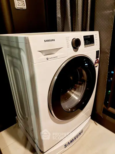 Modern Samsung washing machine in a stylish laundry room setting.
