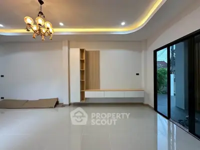 Spacious modern living room with elegant lighting and large windows