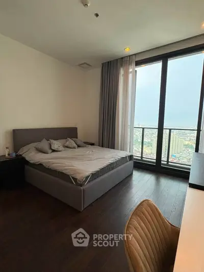 Luxurious bedroom with stunning city view and modern furnishings