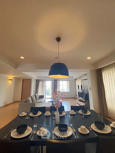 Spacious living room with elegant dining area and modern decor