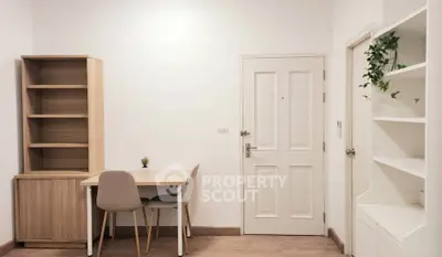 Minimalist study room with wooden furniture and white walls