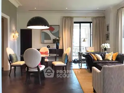 Elegant living room with stylish furniture and large windows for natural light.