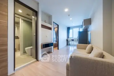 Modern apartment interior with open living room and cozy sofa