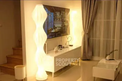 Modern living room with stylish lighting and elegant decor